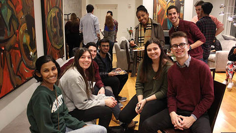 students gathered around a sofa