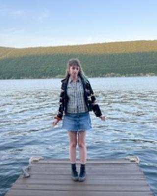 Saffron standing by water