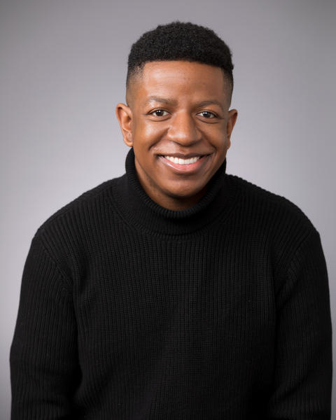 headshot of Clayton