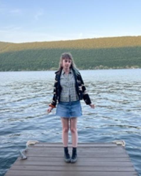 Saffron standing by water