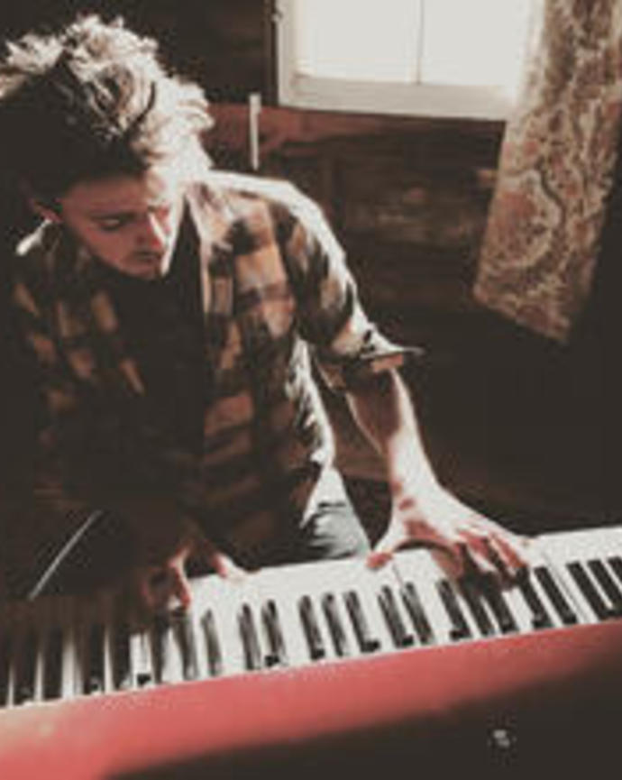 photo of Non-Resident Tutor, Ben playing the piani