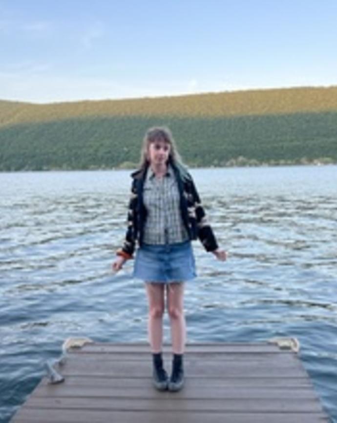 Saffron standing by water