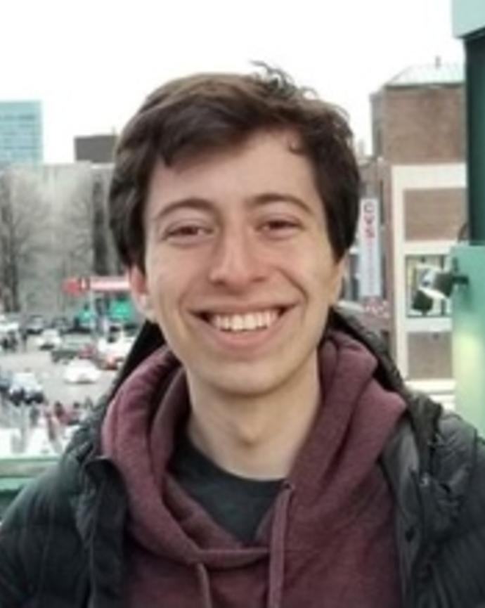 headshot of Resident Tutor Zack in a winter coat at Fenway Park
